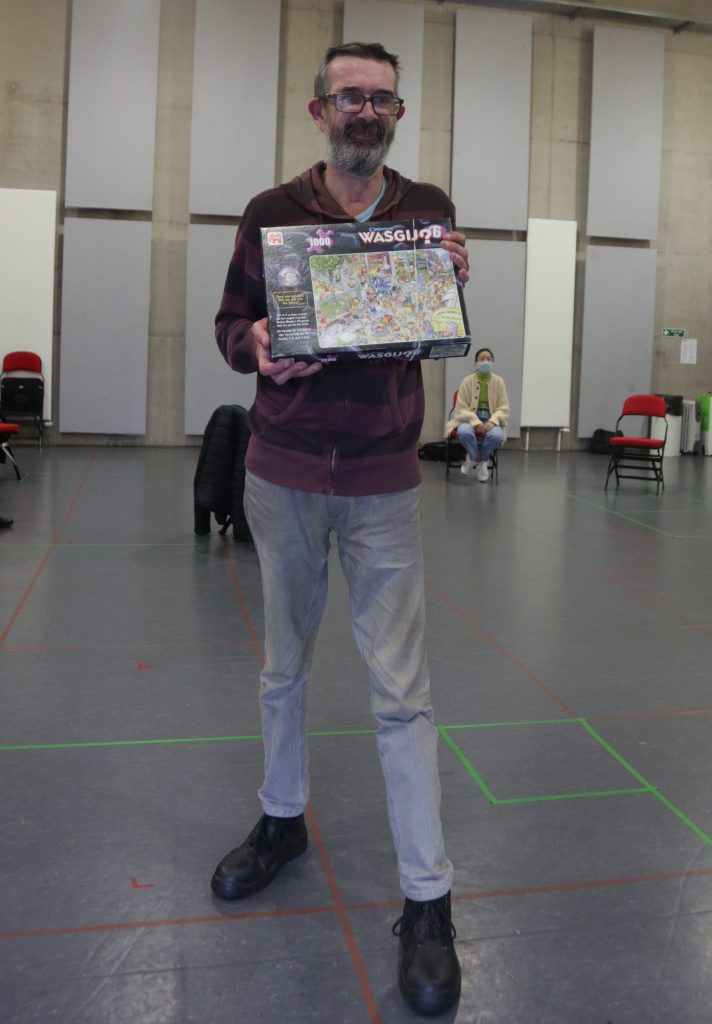 Underground Lights member Malcolm holding a jigsaw puzzle